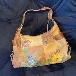 Fossil Purse - good condition. Deep side pockets are lined. Purse is fully